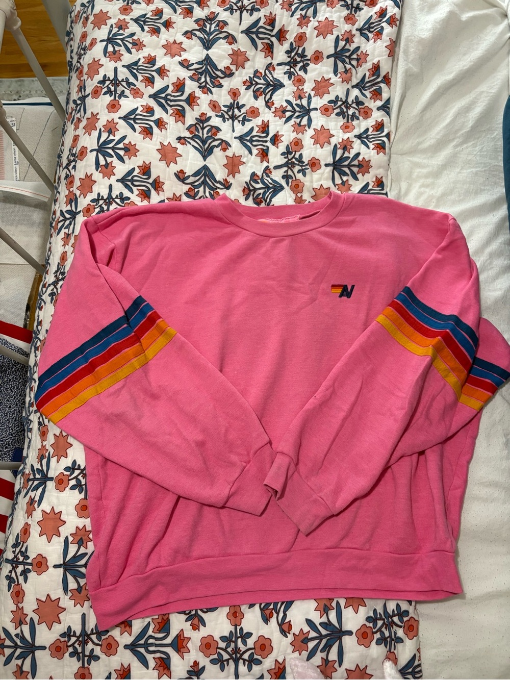 Women’s Pink Crewneck Sweater with Rainbow Stripe Sleeves